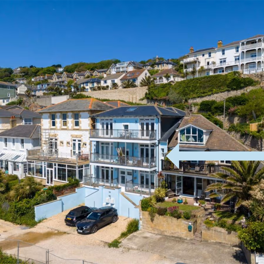 A converted apartment block on a steep road