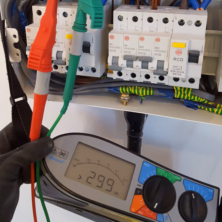 An electrician performing a safety test on a meter
