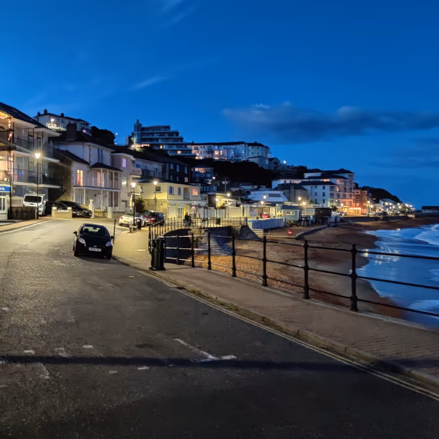 A road along a the front of a seaside town