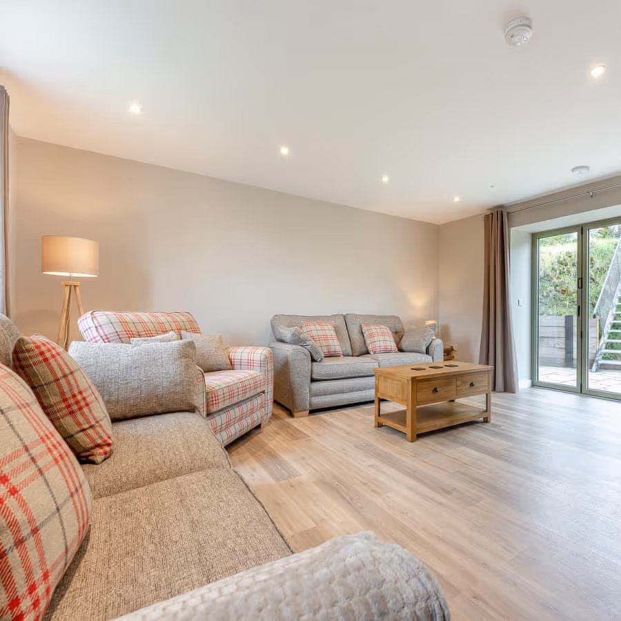 A large modern living room with a wooden floor