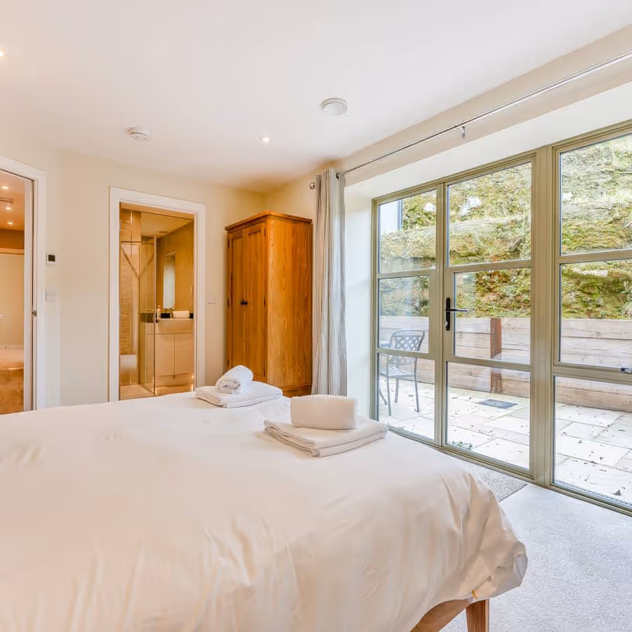 A large bedroom with oak furniture