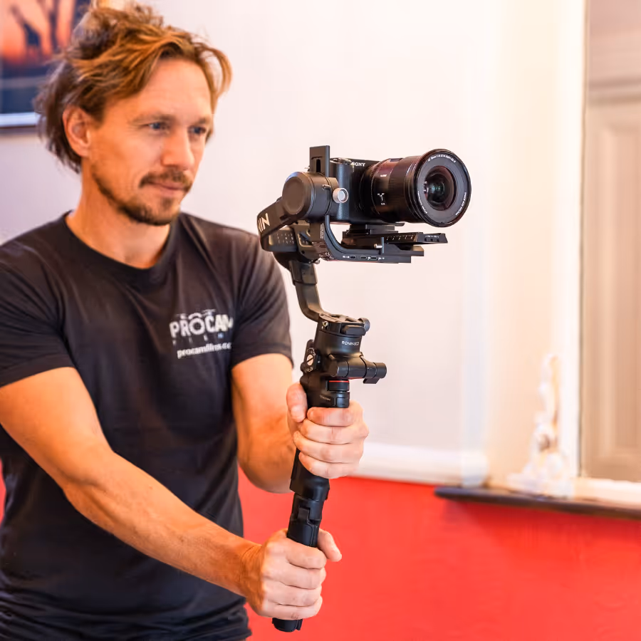 A professional photographer holding a camera