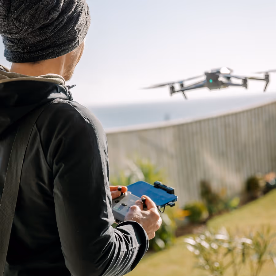 A man operating a flying drone