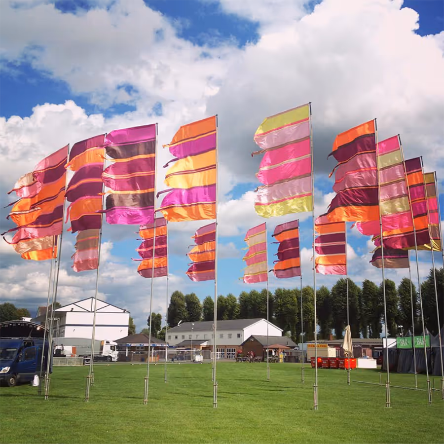 A row of large colourful festival flags