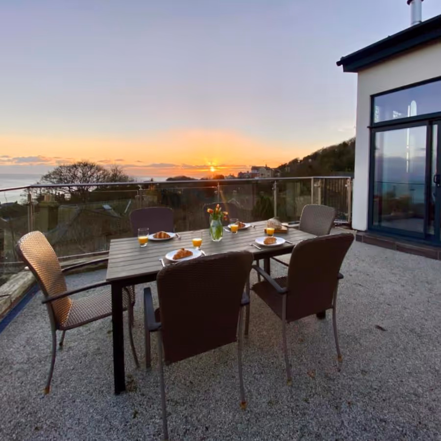 An outdoor terrace at sunrise