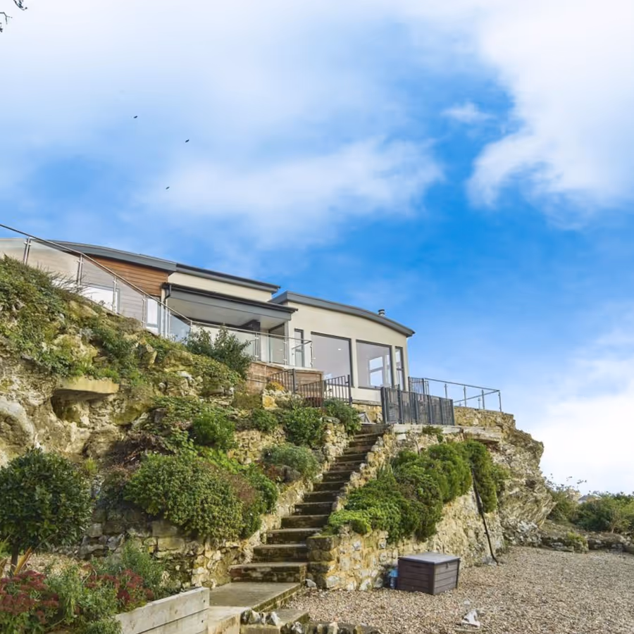 A steep terraced garden of a modern house