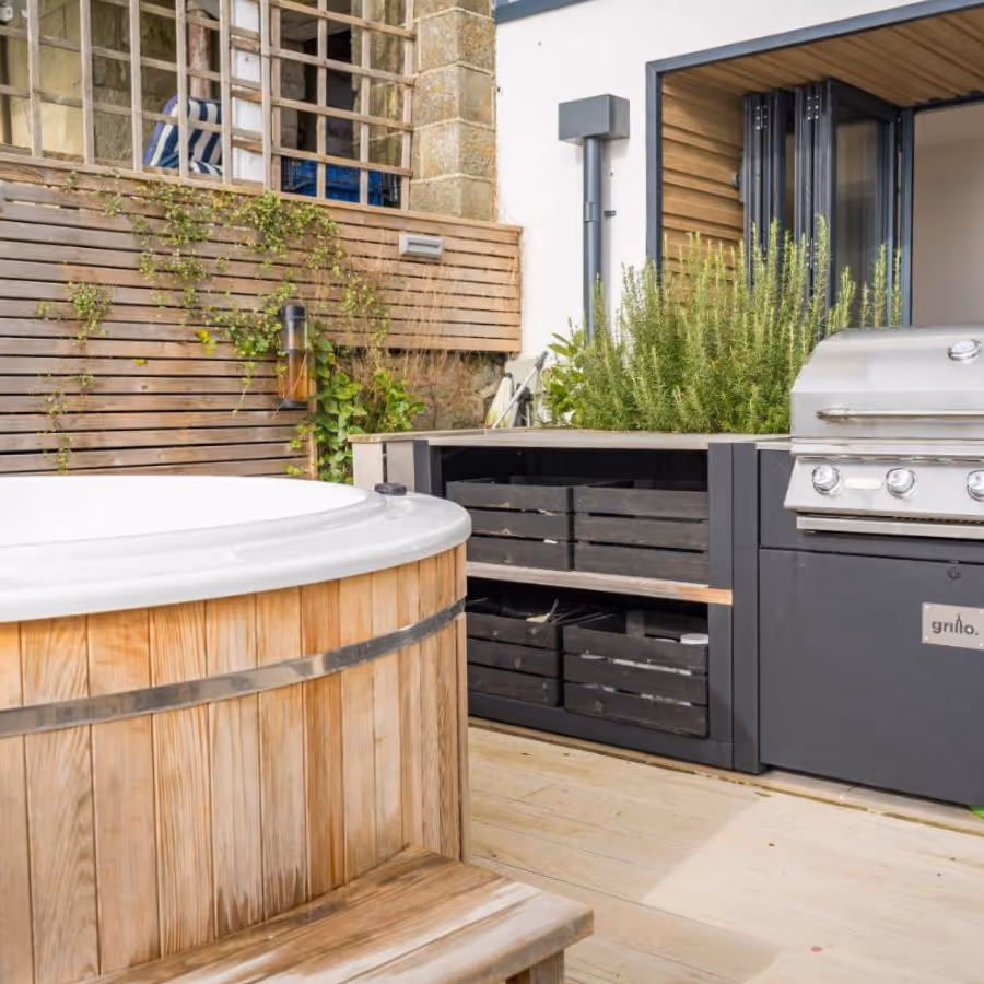 An outdoor kitchen and hot tub