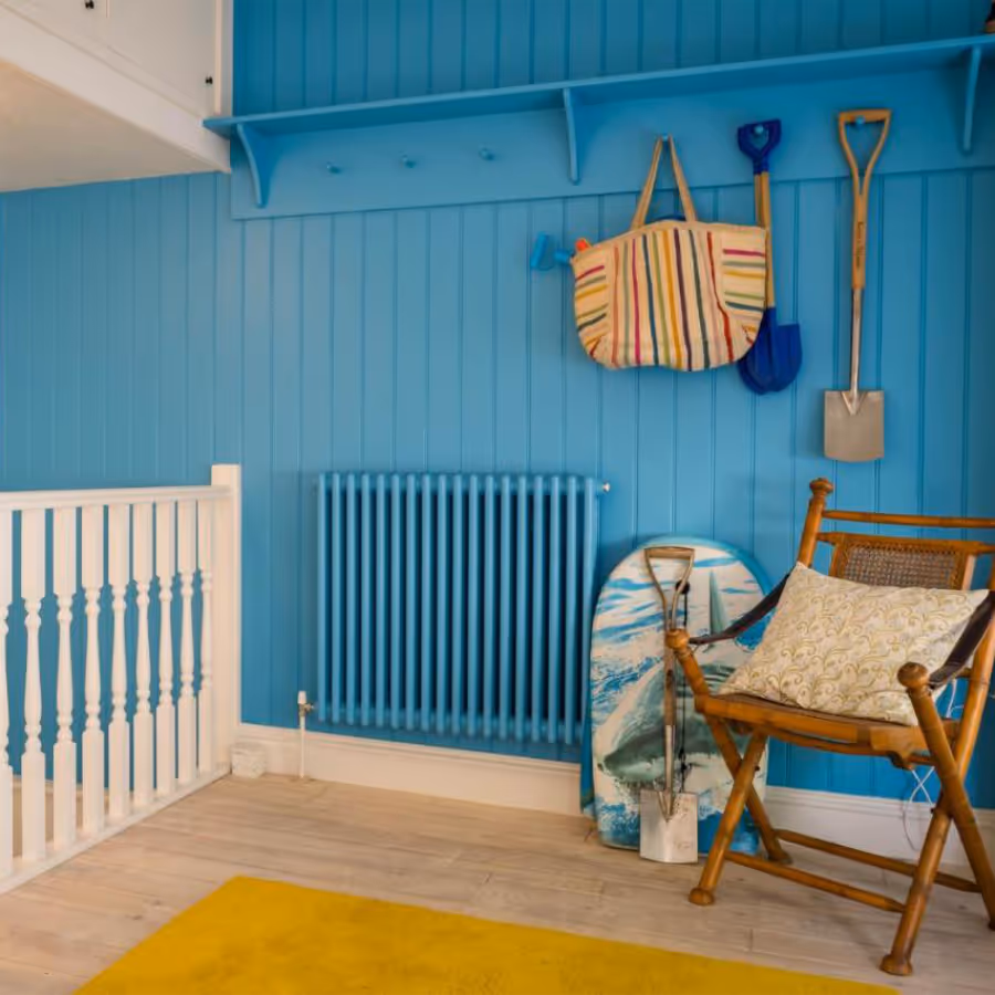 A landing painted in bright turquoise