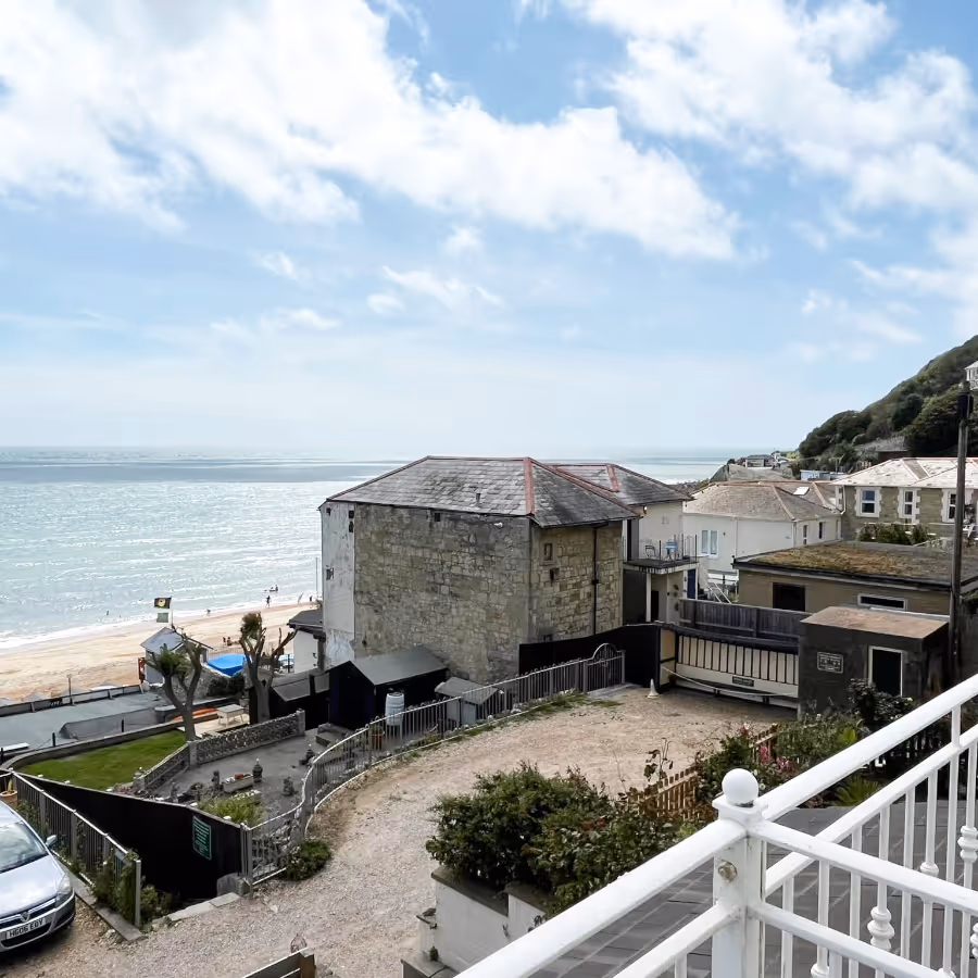 A balcony with a stunning sea view