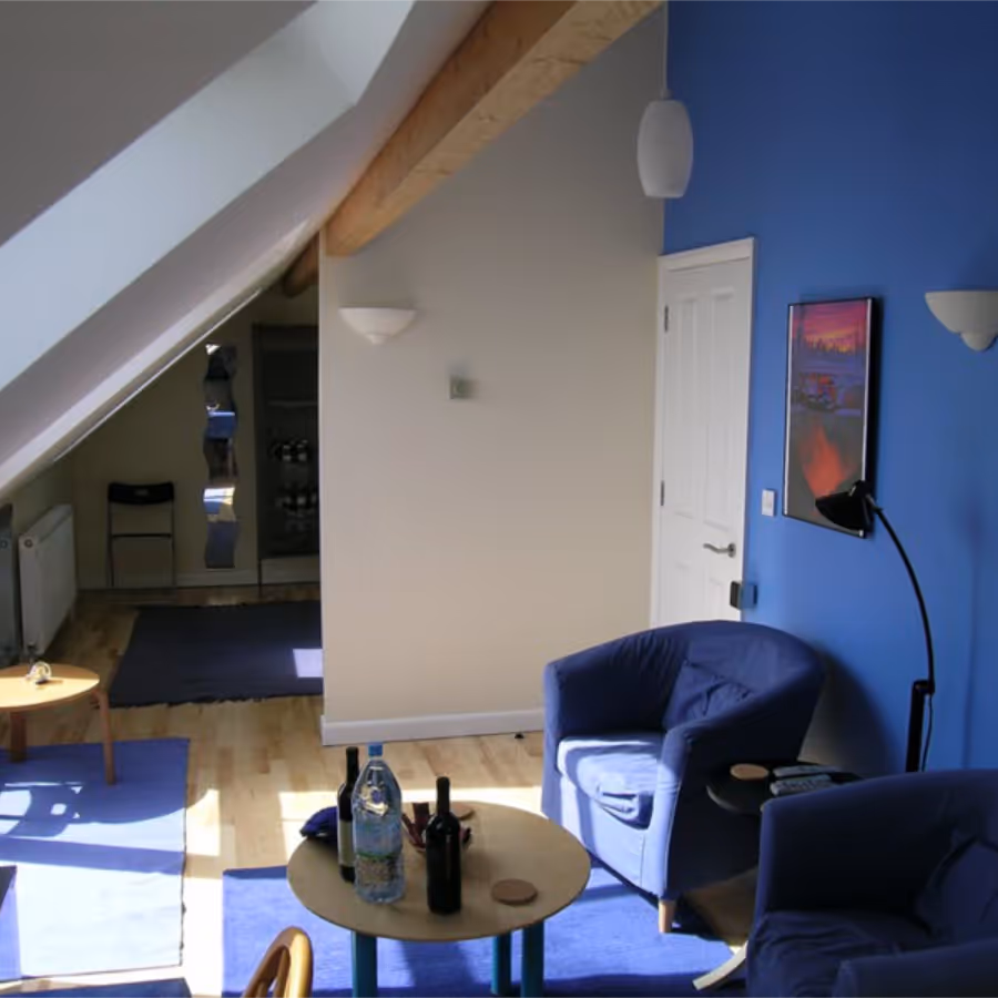 A blue living room in an attic