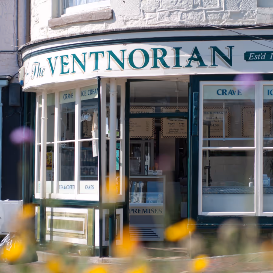 The exterior of a Victorian shop with a curved frontage
