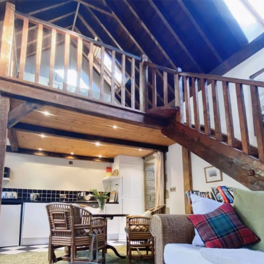 A timber galleried landing above a kitchen