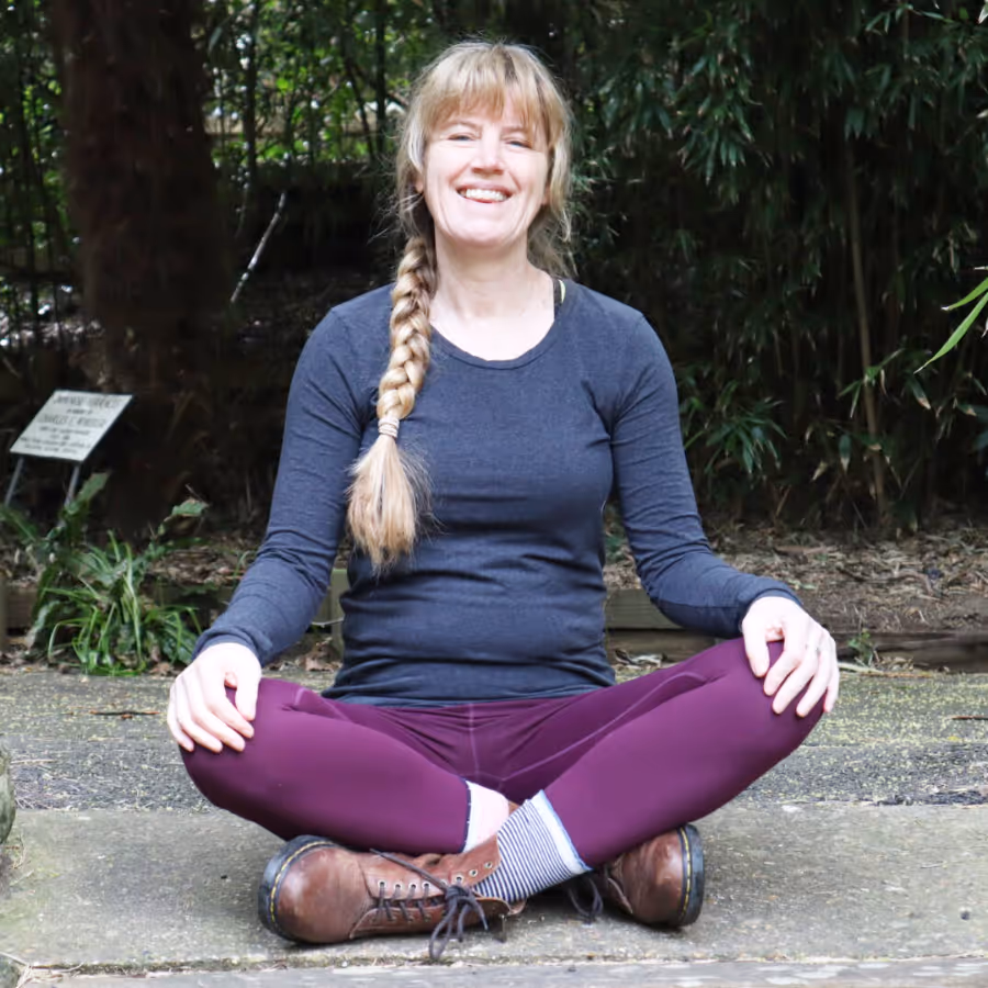 A woman in a seated yoga position