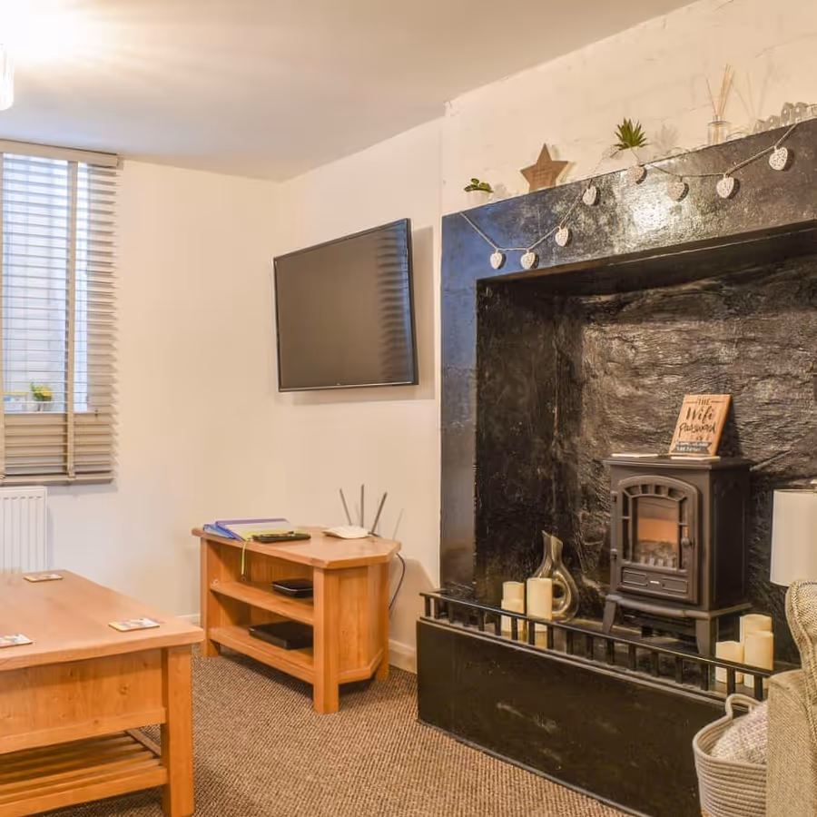 A big fireplace in a house that use to be an old bakery