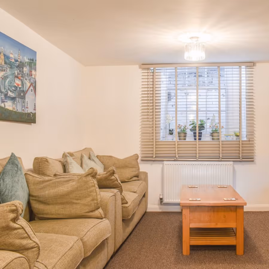 A neutral living room with two sofas