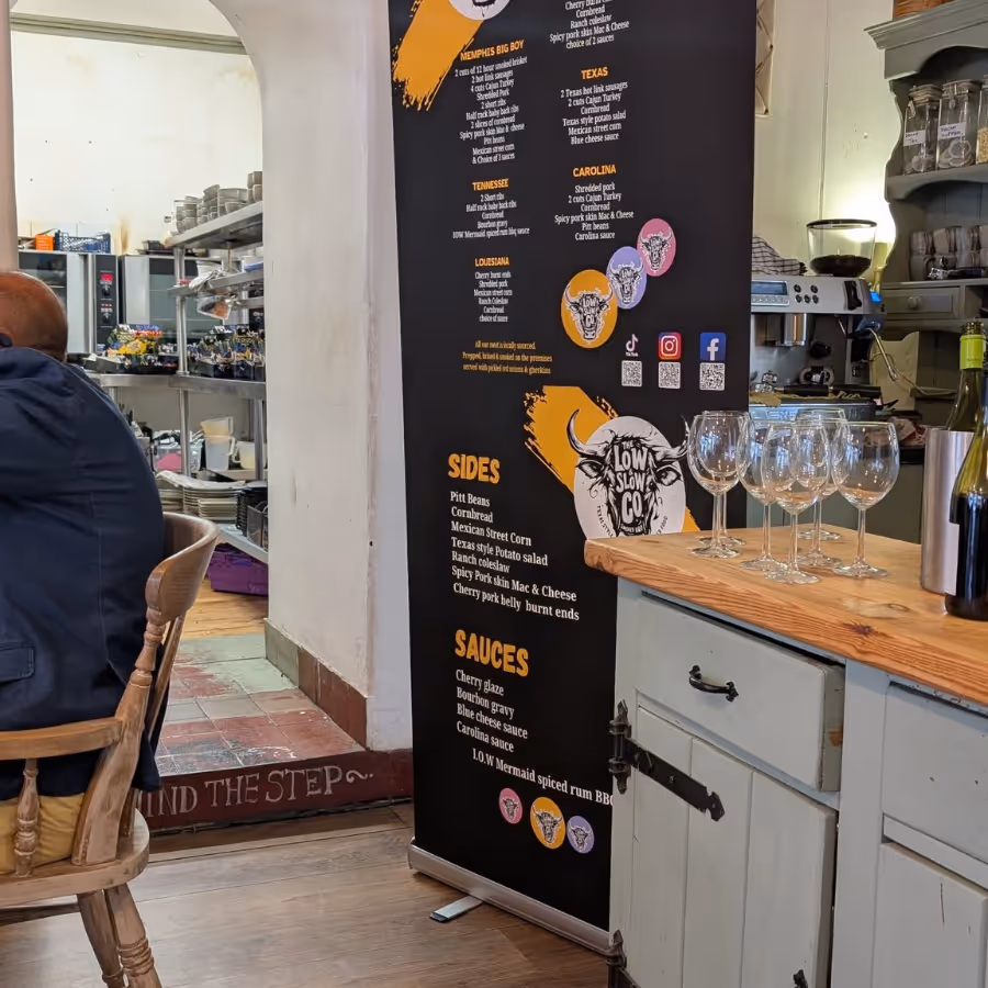 A banner menu stood in a restaurant