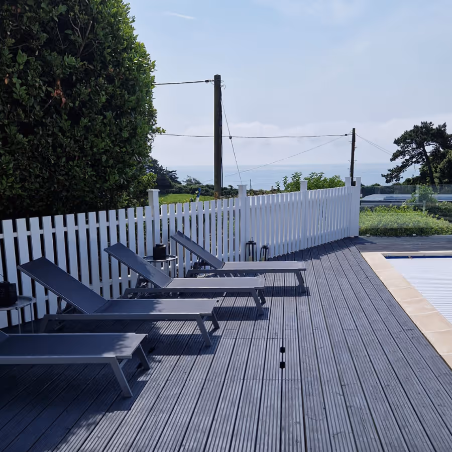 Modern grey decking with matching grey sun loungers