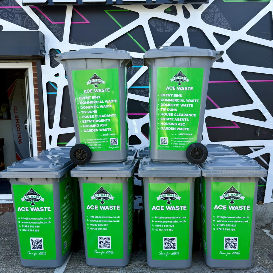 A stack of 6 wheelie bins