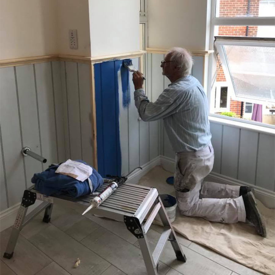 A main painting a wall