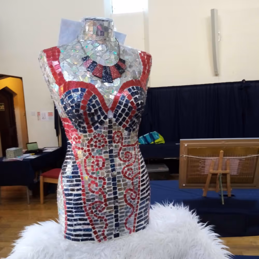 A 3D mosaic sculpture of the female form.