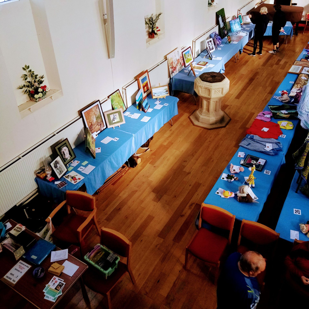 Looking down at a craft festival in a church.