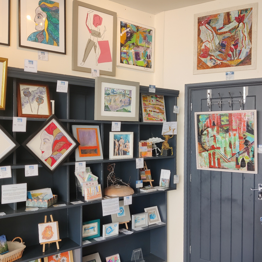 Artwork and gifts for sale in an art gallery.