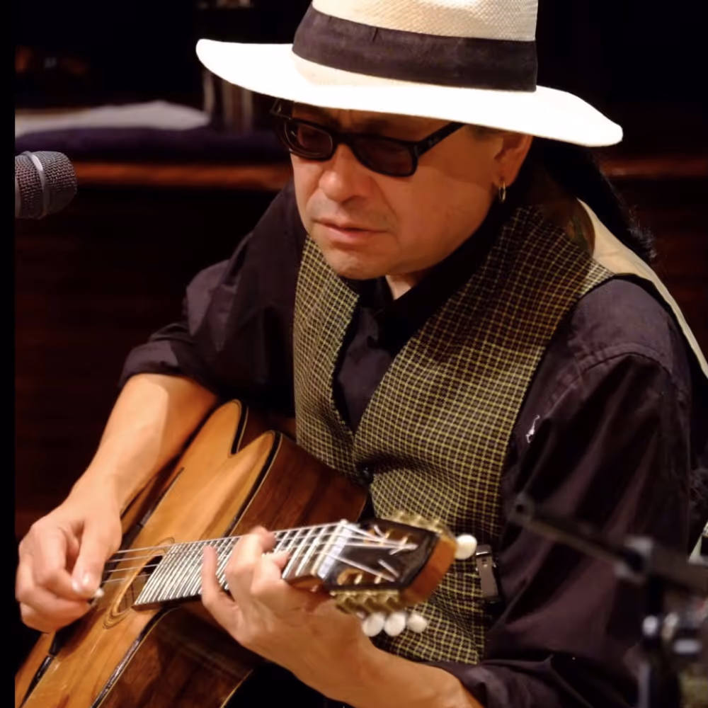 A man playing guitar.