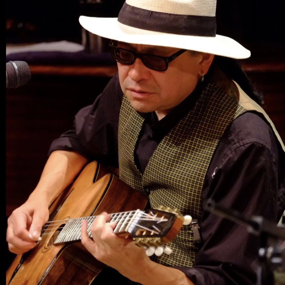 A man playing guitar.