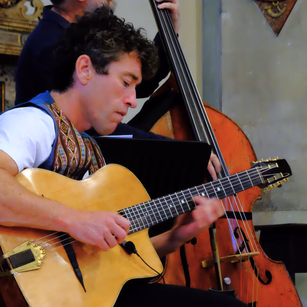 A man playing guitar.