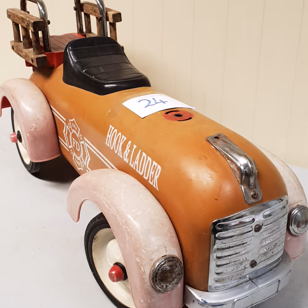 An antique child's pedal car.