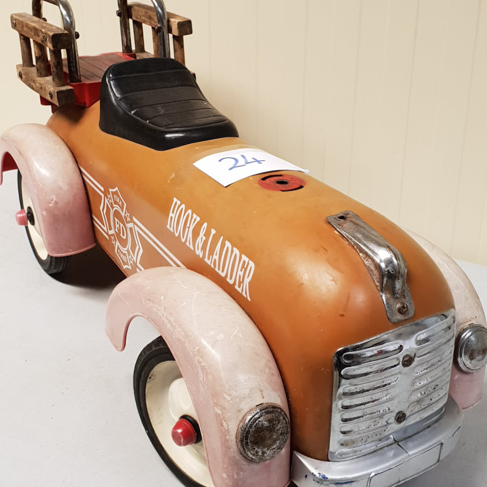 An antique child's pedal car.