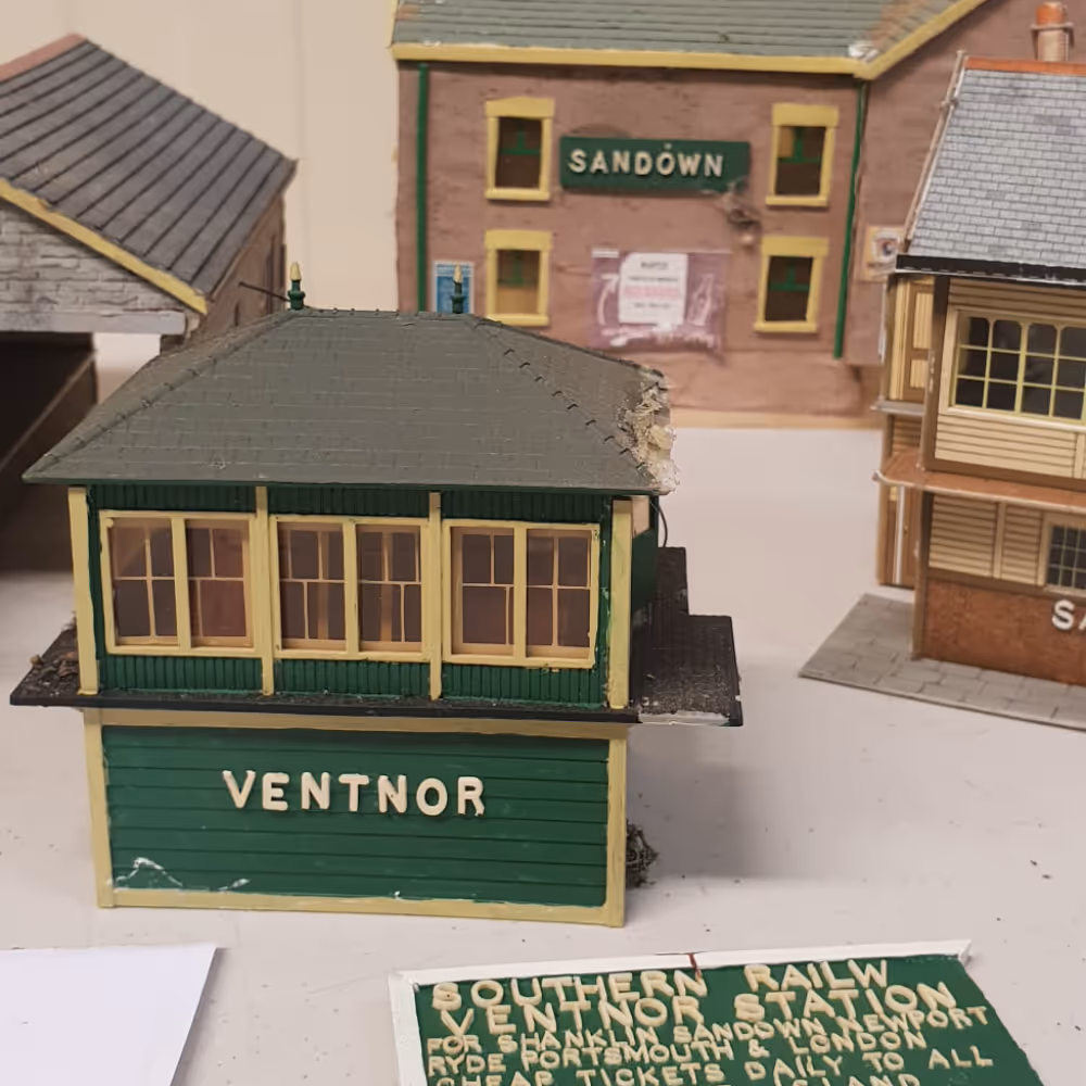 A collection of antique trainset buildings.