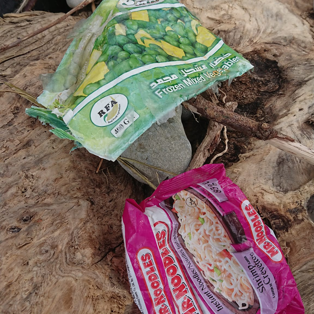 Discarded plastic bags on a beach.