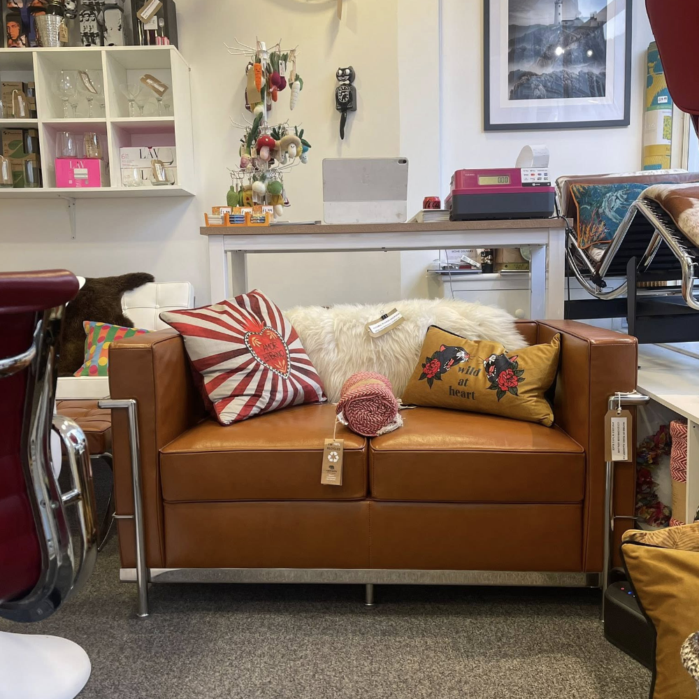 A modern brown leather sofa in a shop