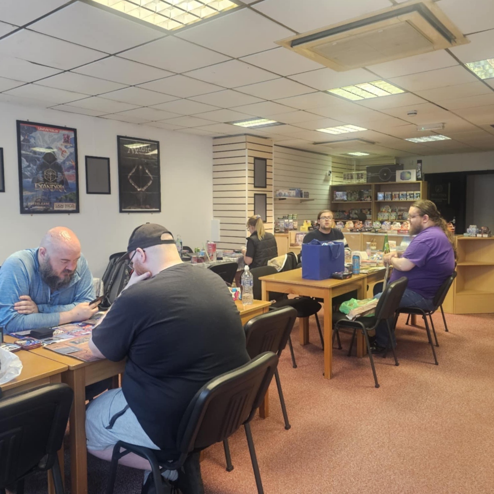 People playing card games in a room