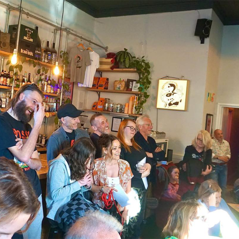 People enjoying an evening of entertainment in a bar.