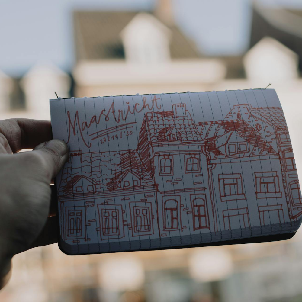 A sketch in a small notebook.