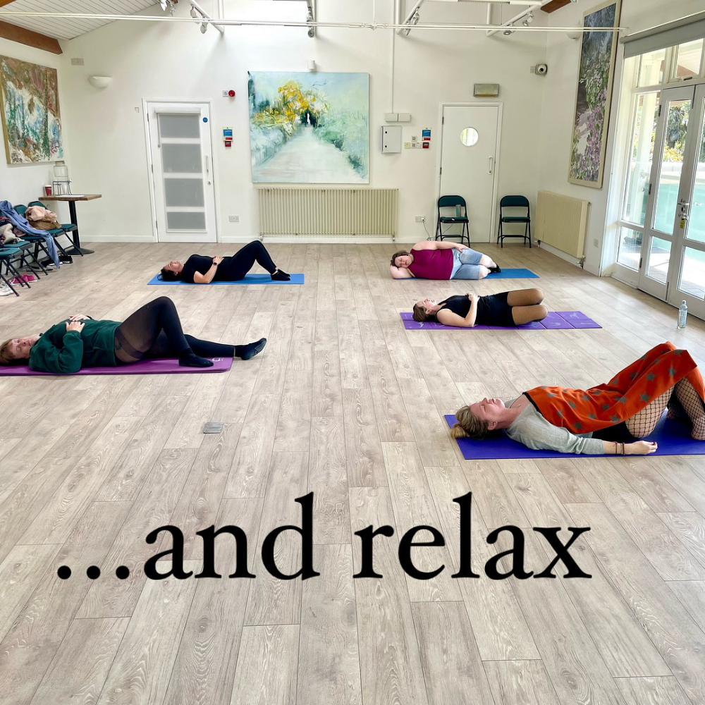 People in a unisex stretch class.