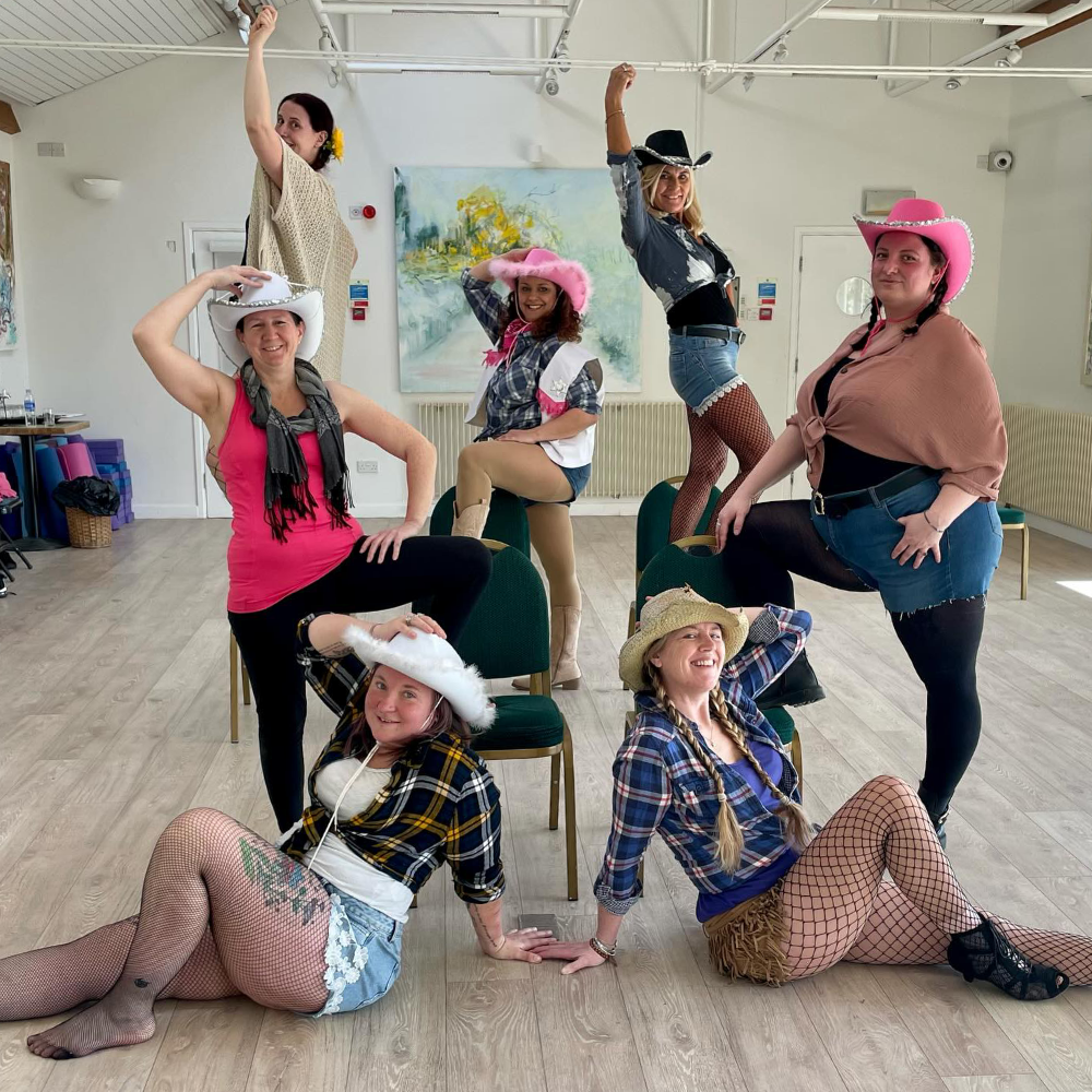 Burlesque dancers in cowboy costumes.