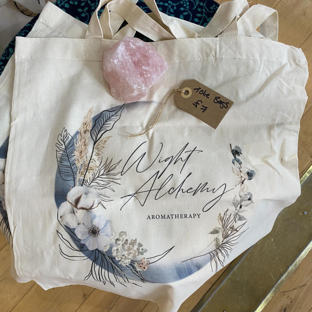 A tote bag with a printed logo.