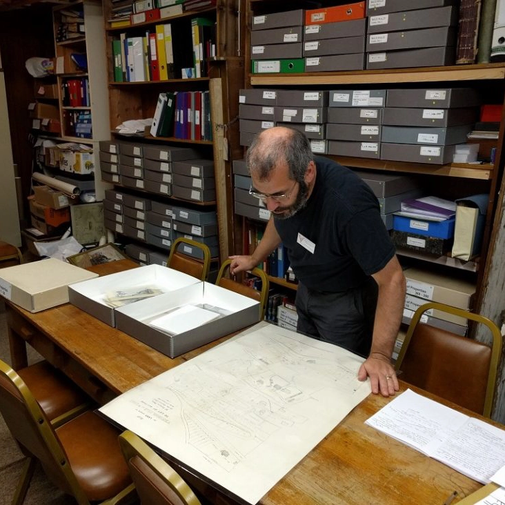 A man reading information in a museum.