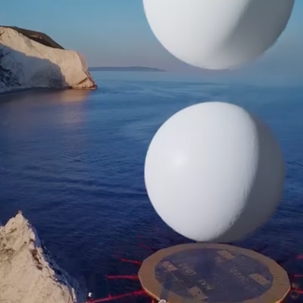 Two CGI spheres rising from the top of a lighthouse helipad.