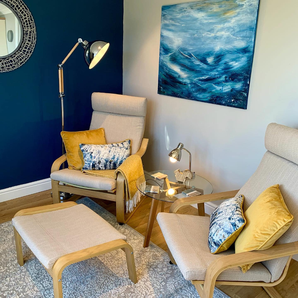A coastal themed living room in blue and white.
