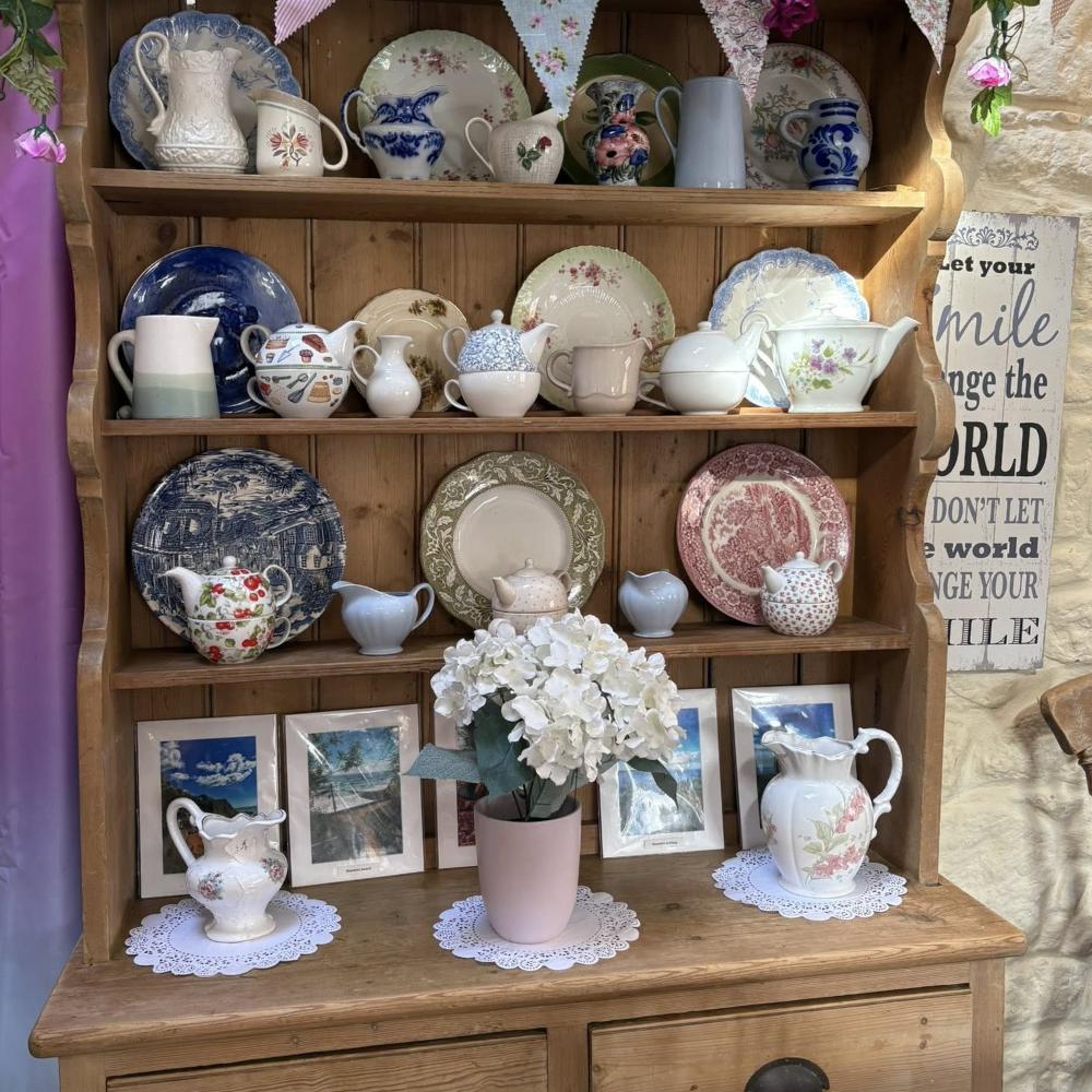 A pine dresser filled with vintage china