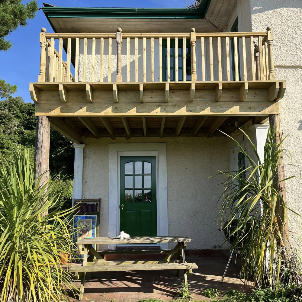 A first floor wooden balcony.