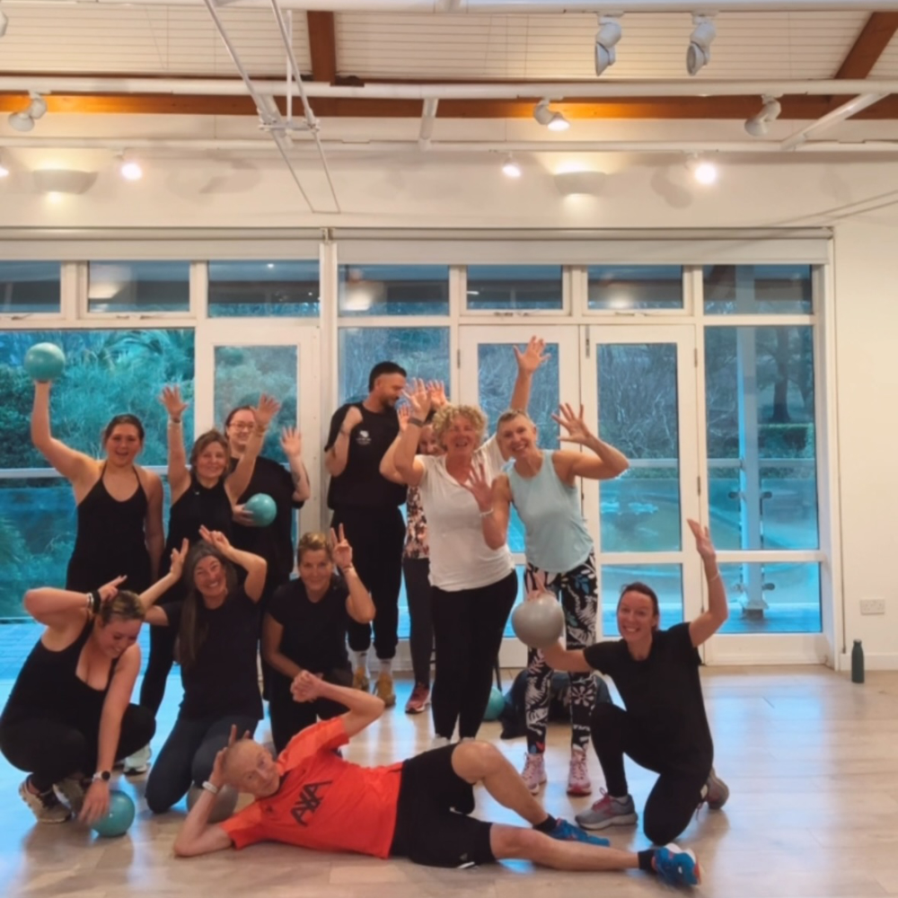 A group of people at a boot camp fitness class