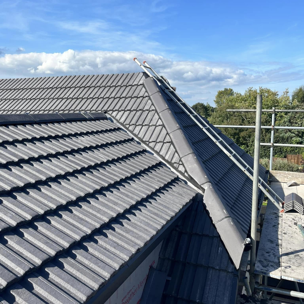 A roof being tiled.
