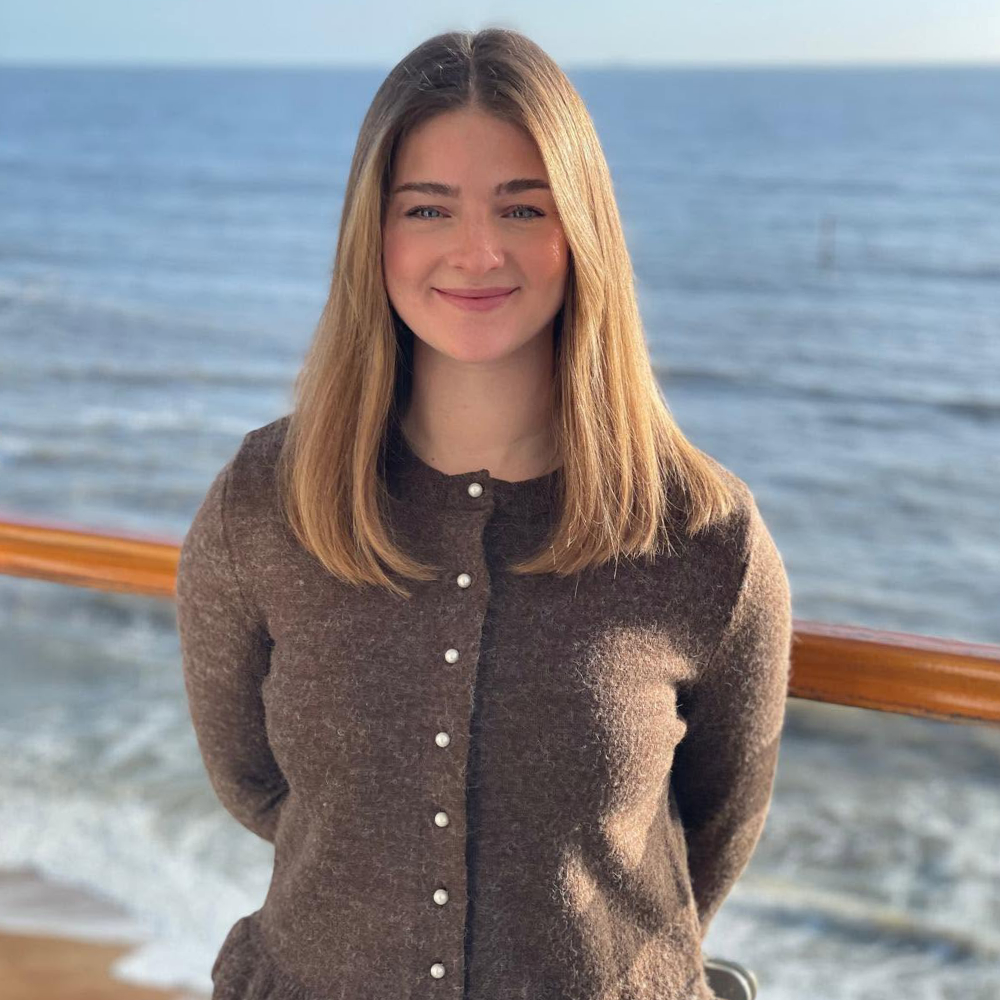 A young woman by the sea.
