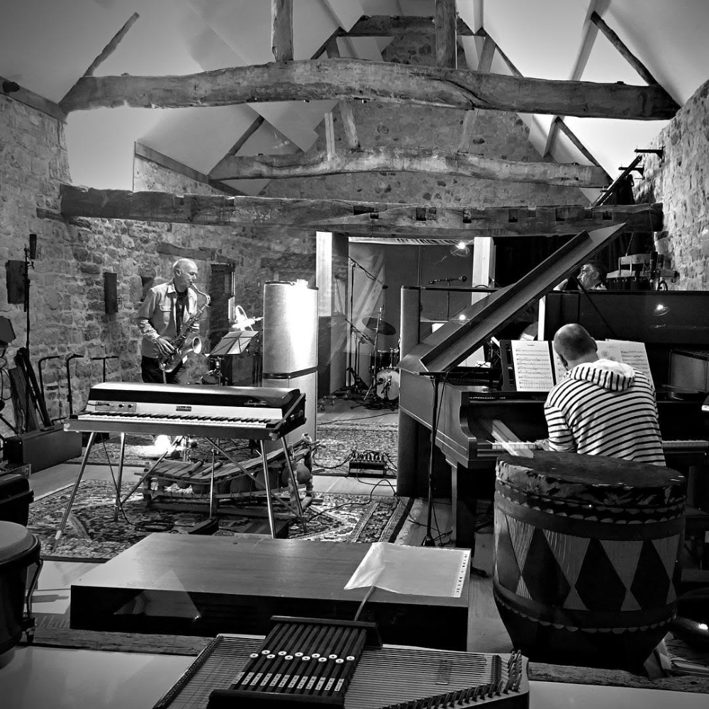 A band performing in a music studio.