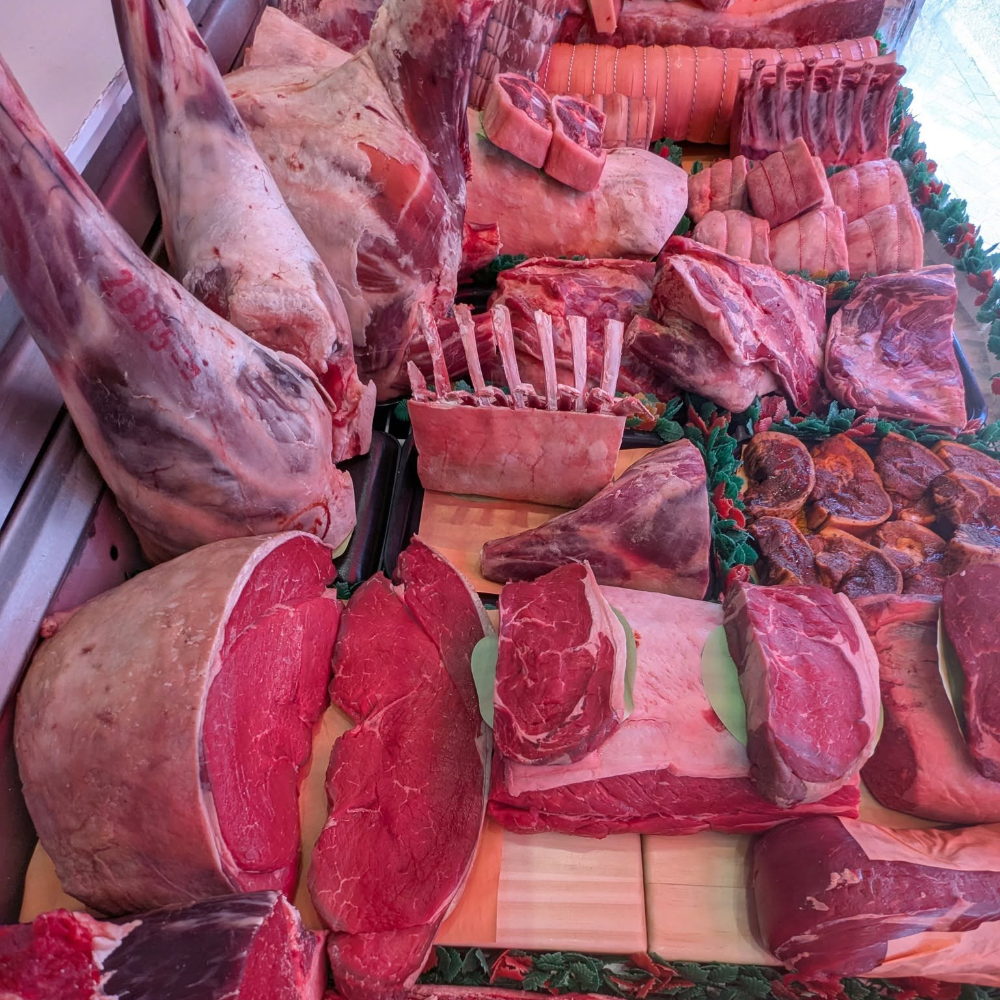 Fresh meat in a butchers window.